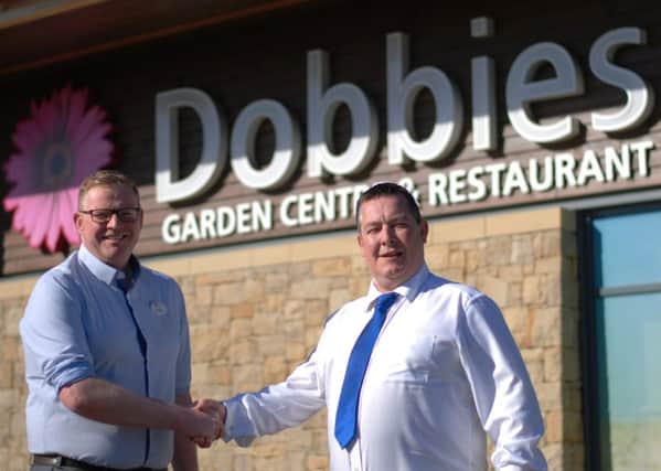 John Paterson, general manager at Dobbies Braehead, left, with John Nelson of DM Design. Picture: Contributed