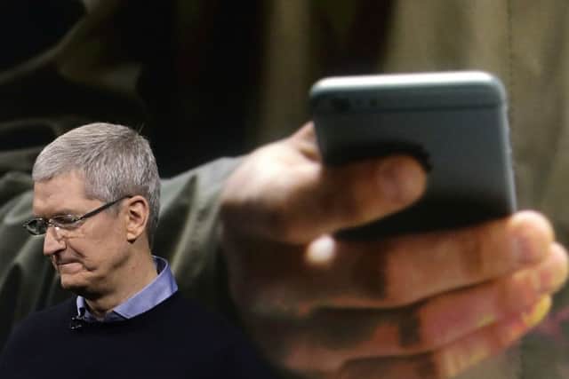 Apple, led by chief executive Tim Cook, saw sales fall for the first time in 13 years. Picture: Marcio Jose Sanchez/AP