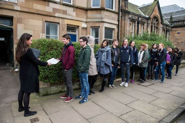 Prospective renters form a queue outside a property being made available to view. Picture: Ian Georgeson