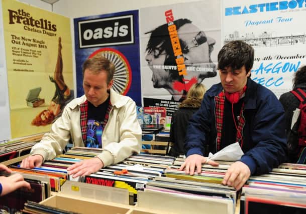 Customers browse titles in the former Avalance Records store in the Grassmarket, Edinburgh, in 2013. Picture: Ian Rutherford/TSPL