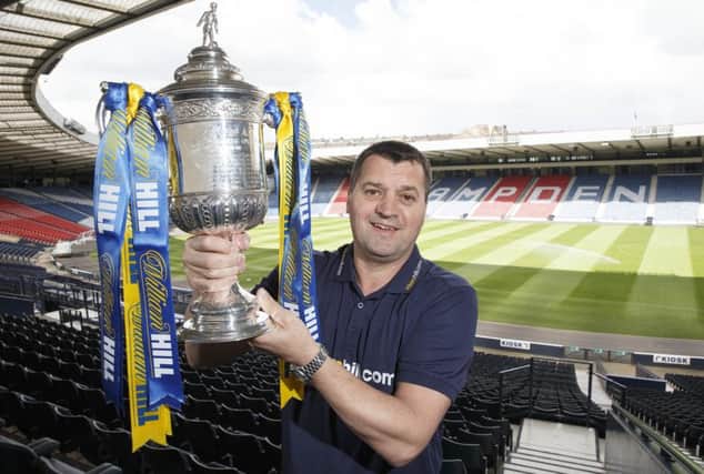 Pat McGinlay with the Scottish Cup, which he believes Hibs can lift if their players can come to terms with the big occasion better than they did in the League Cup final. Picture: Steve Welsh