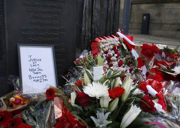 Floral tributes left at a Hillsborough memorial in Old Haymarket Picture: Peter Byrne/PA Wire