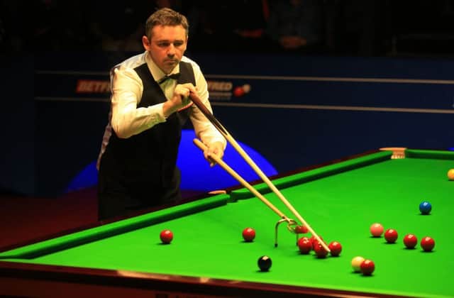 Mark Selby celebrates his 13-8 victory over Kyren Wilson, who had the consolation of a 143 break. Picture: PA
