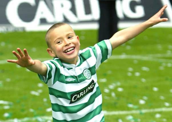 Jordan celebrating at Celtic Park in 2004 after his father helped Celtic clinch the league title. Picture: PA