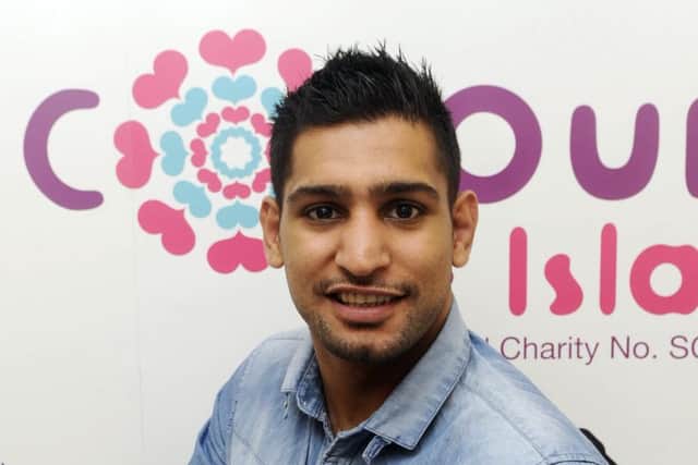 Khan took time out of his preparations to congratulate his nephew. Picture: Greg Macvean