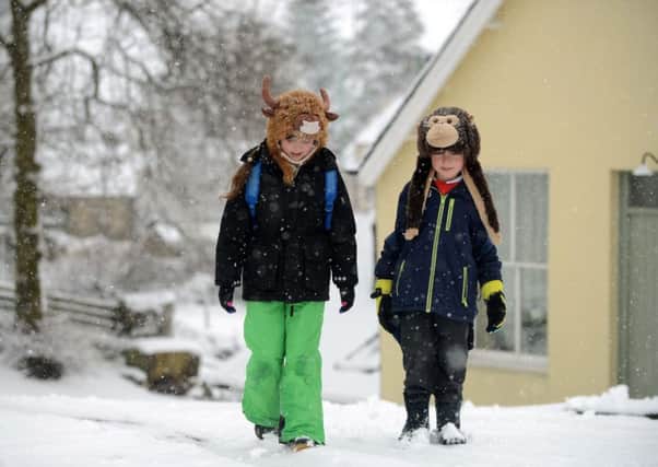 Brothers Ivor and Gwen Foley on their way to school in heavy snow in Leadhills, Lanarkshire. Picture: Hemedia
