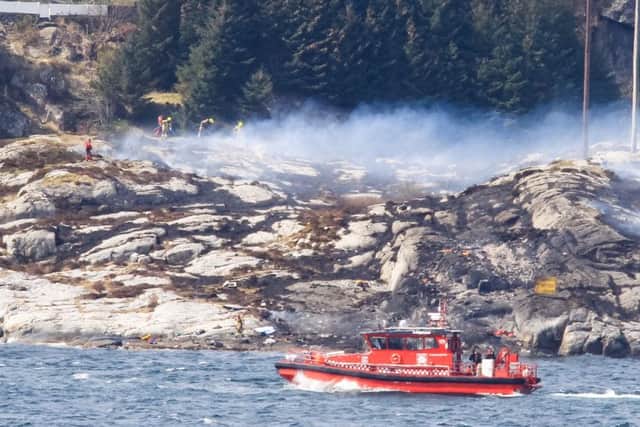 Rescue forces work at the shore west of Bergen, Norway after a helicopter transporting 13 workers from an offshore oil field in the North Sea crashed off Picture: AFP/Getty Images