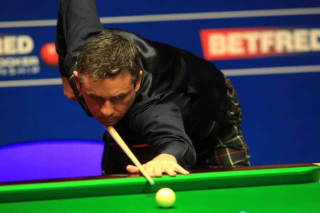 Alan McManus in action against Ding Junhui at the Betfred Snooker World Championships at the Crucible. Picture: Mike Egerton/PA Wire