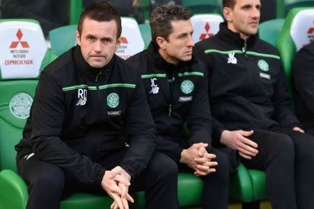 Celtic boss Ronny Deila believes John Collins, centre, and John Kennedy, right, could step up to the roles of manager and assistant manager when he leaves at the end of the season. Picture: SNS