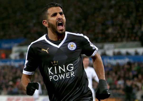 Riyad Mahrez celebrates a goal for Leicester - but the Algerian has revealed he escaped from a trial with St Mirren. Picture: AFP/Getty Images