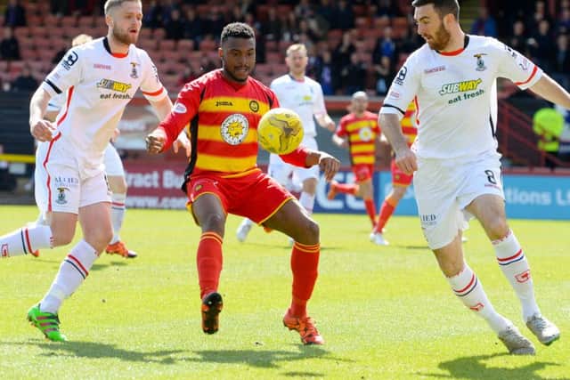 Partick Thistle's David Amoo is closed down by Ross Draper Picture: SNS Group