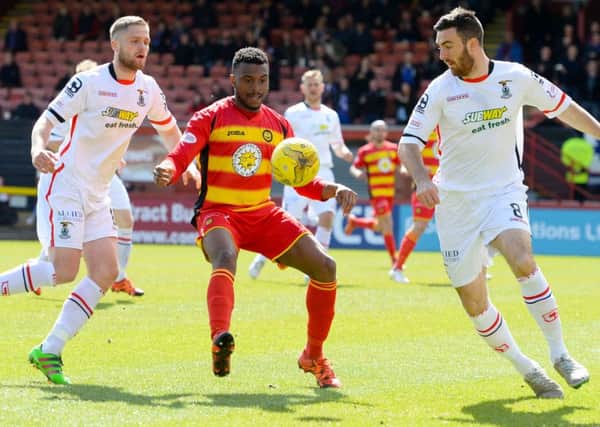 Partick Thistle's David Amoo is closed down by Ross Draper Picture: SNS Group