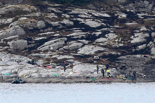 Police and rescue workers work at the site of a helicopter crash on the island Turoy  Picture: OUTVIDAR RUUD/AFP/Getty Images