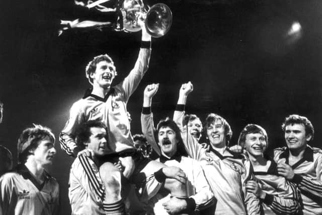 McAlpine celebrating a League Cup win at Dens Park. Picture: TSPL