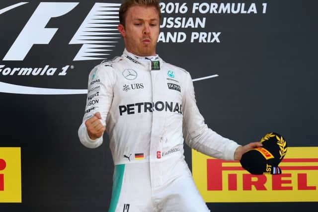 Nico Rosberg jumps to celebrate his win on the podium at the Russian Grand Prix in Sochi. Picture: Getty Images
