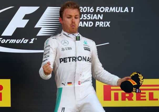 Nico Rosberg jumps to celebrate his win on the podium at the Russian Grand Prix in Sochi. Picture: Getty Images