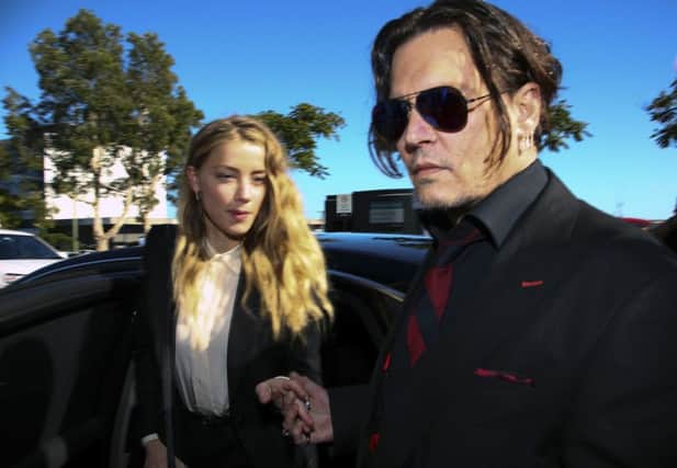 US actor Johnny Depp and his wife Amber Heard arrive at a court in the Gold Coast. Picture: Getty Images