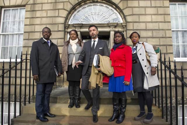 The family of Sheku Bayoh and their solicitor Aamer Anwar, who yesterday compared the case with the respones of the police to the Hillsborough disaster. Picture: TSPL