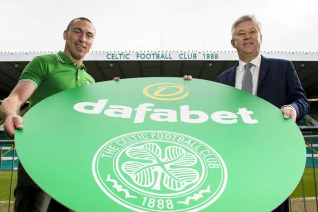 Celtic Chief Executive Peter Lawwell, right, and captain Scott Brown announce the biggest ever shirt sponsorship deal in Scottish football history as Dafabet are named as a newm main club sponsor. Picture: Craig Foy/SNS