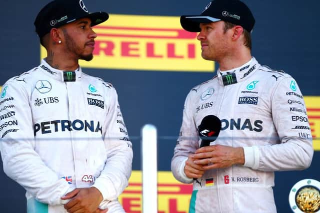 Lewis Hamilton, left, with Nico Rosberg on the podium after the Russian Grand Prix. Picture: Dan Istitene/Getty Images