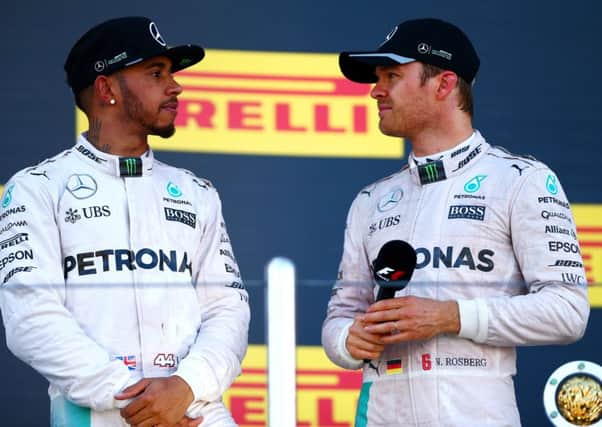 Lewis Hamilton, left, with Nico Rosberg on the podium after the Russian Grand Prix. Picture: Dan Istitene/Getty Images