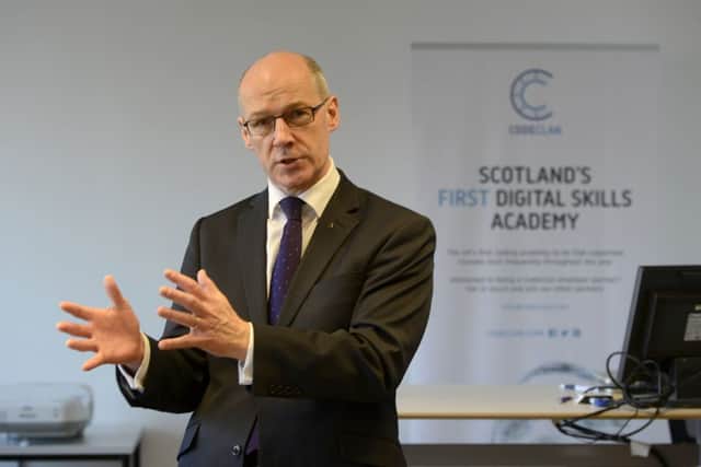 Deputy First Minister John Swinney warned Labour would spend up to Â£500 million less on the NHS. Picture: TSPL