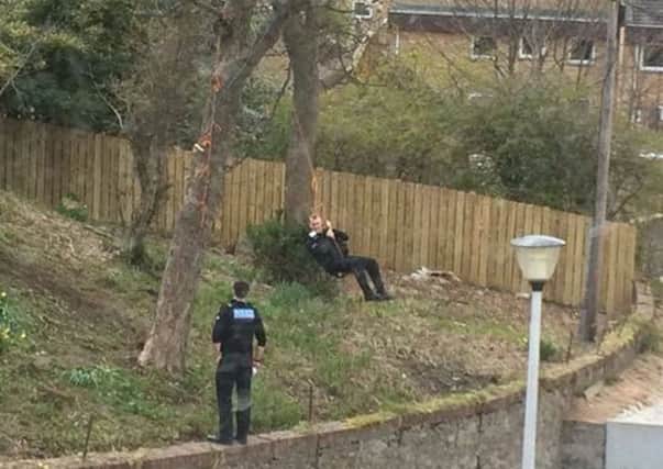 The police officers were responding to an incident in the Torry area of Aberdeen when one office decided to have a go on the rope swing. Picture: Tracy Marie Marr/Facebook