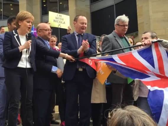 Nicola Sturgeon is confronted by a protester. Picture: John Devlin. Video: Chris McCall