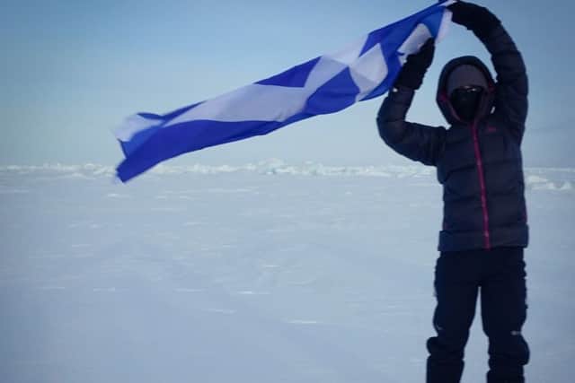 Kate Walker with the Scottish flag in the North Pole