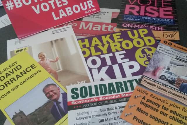 Various campaign posters aimed at voters ahead of Thursday's Holyrood election