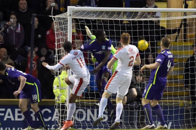Raith's Harry Panayiotou (11) scores the game's only goal. Picture: SNS