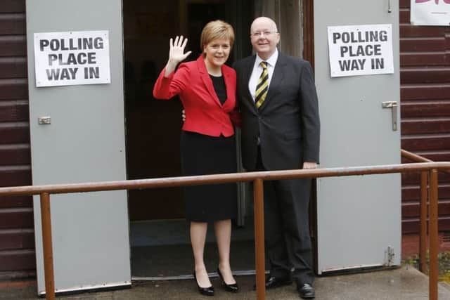 SNP leader Nicola Sturgeon and her husband Peter Murrell depart the polling station at Broomhouse Community Hall in Glasgow on 5 May. Picture: PA Wire