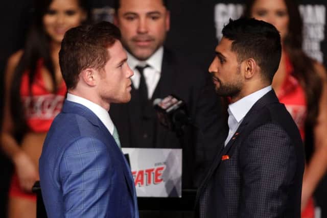 Mexico's Saul Alvarez, left, and Amir Khan ahead of their fight in Las Vegas. Picture: John Gurzinski /AFP/Getty