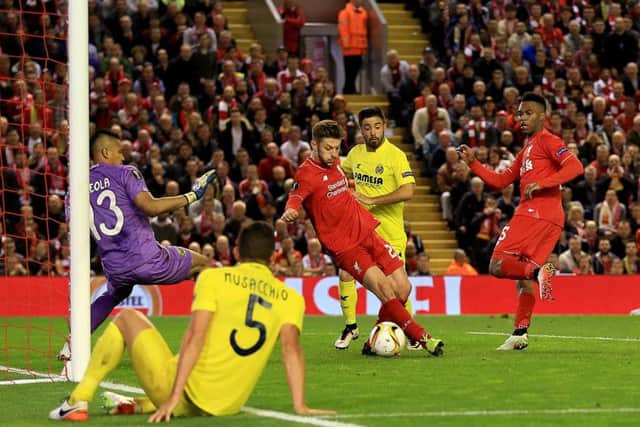 Adam Lallana scores Liverpool's third goal. Picture: PA.