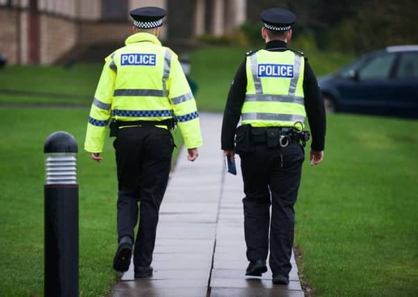 Two police officers were injured during a disturbance. Picture: John Devlin