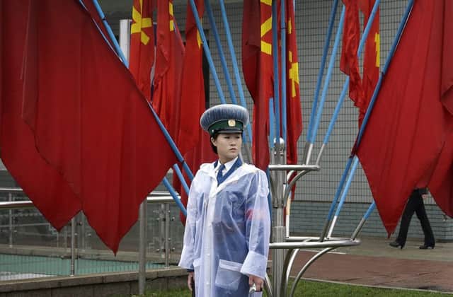 Pyongyang has been spruced up and bedecked with red flags but the foreign journalists flown in to tell the world about the congress are locked out. Picture: AP