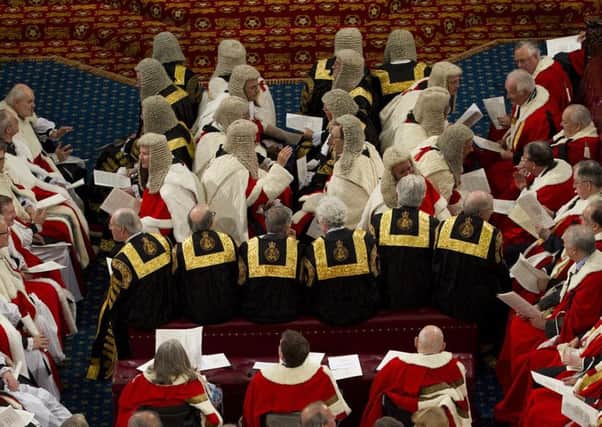 Pomp and ceremony: peers wait to hear the Queens Speech at the State Opening of Parliament at Westminster. Picture: AFP/Getty