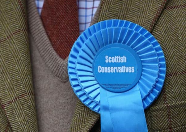 The rosette of a Scottish Conservative Party supporter. Picture: Getty Images