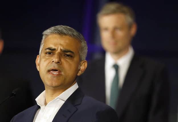 Sadiq Khan, Labour Party candidate, speaks in front of Zac Goldsmith, Conservative Party candidate, after winning the London mayoral elections at City Hall, London. Picture: AP Photo/Kirsty Wigglesworth