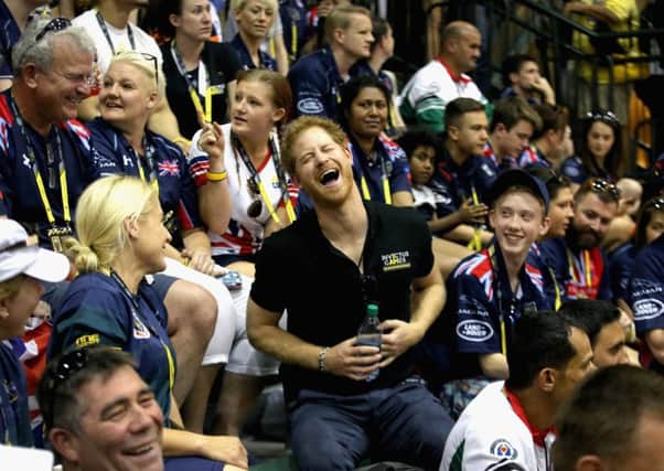 Prince Harry sits with the crowd as he watches the sitting volleyball at the Invictus Games in Orlando. Picture: Getty