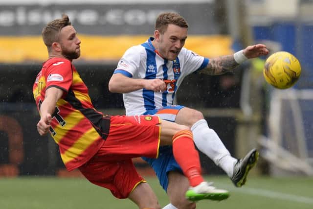 Partick Thistles Christie Elliott battles with Kilmarnocks Mark OHara during a game in which Kilmarnock reverted to ineptitude. Picture: SNS