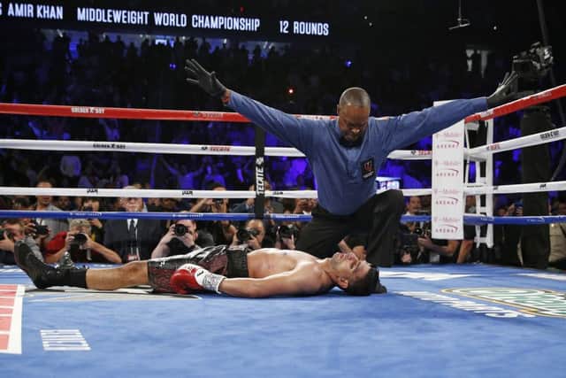 Amir Khan lies unconscious on the canvas after a pulverising right hook ended his world title dream in the sixth round of his fight against Saul Alvarez in Las Vegas. Picture: AP