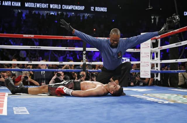 Amir Khan lies unconscious on the canvas after a pulverising right hook ended his world title dream in the sixth round of his fight against Saul Alvarez in Las Vegas. Picture: AP