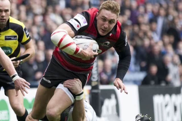 Dougie Fife, playing his final match for Edinburgh, is caught by Cardiffs Tom James. Picture: SNS
