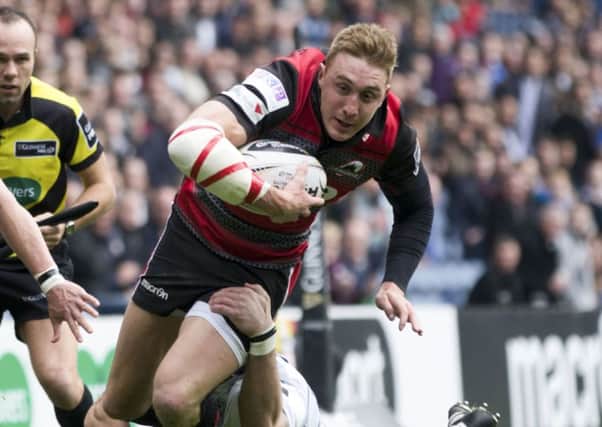 Dougie Fife, playing his final match for Edinburgh, is caught by Cardiffs Tom James. Picture: SNS