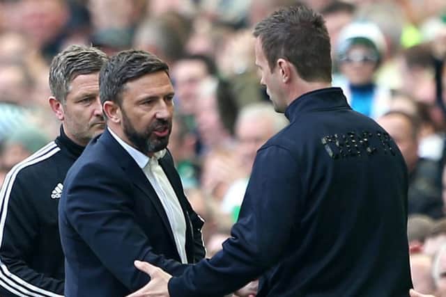 Derek McInnes, left, congratulates Celtic manager Ronny Deila on his teams title success. Picture: PA