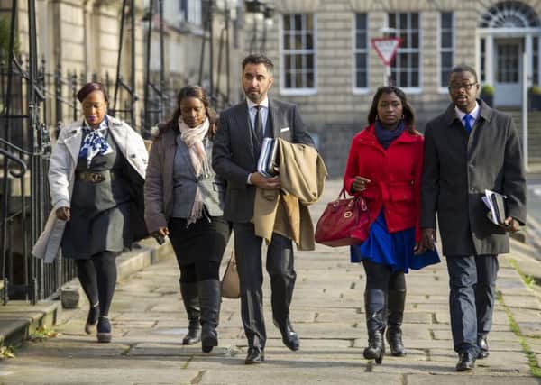 The family of the late Sheku Bayoh and their solicitor, Aamer Anwar.

Picture: Ian Rutherford
