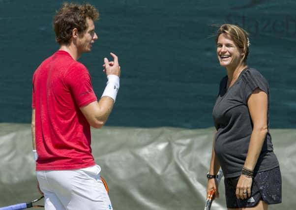 Murray with Mauresmo during a practice session at Wimbledon last year. Picture: Ian Rutherford