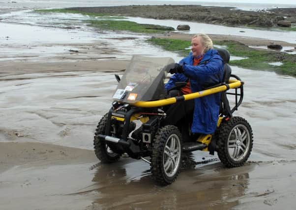 Debbie's TerrainHopper wheelchair has been specially-adapted for use on rough surfaces and cross-country hillwalks. Picture: Contributed