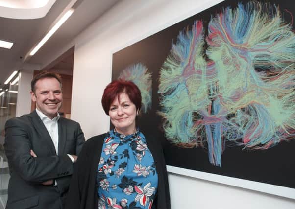 Julie Duffus with Professor Craig Ritchie who is part of the research team at Edinburgh University. Picture: Callum Bennetts/Maverick Photo Agency